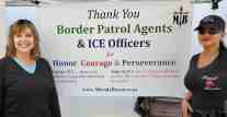 Morale Boosters, Quality Control Officer, Diane Langan standing in front of the banner with an LEO Officer at the Women's Shooting Event in San Diego.