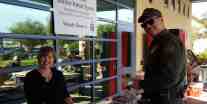 Diane Langan of Morale Boosters serving lunch to USBP agent, at El Centro Sector station