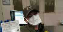 USBP agent, with N95 mask, points to thank you card given to her, provided by Morale Boosters