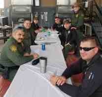 Several Agents at Calexico Station of USBP enjoy a Carne Asada BBQ lunch served by Morale Boosters.