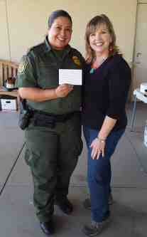Sector Chief, Gloria Chavez, posed for a picture with Diane Langan of Morale Boosters.  Chief Chavez is holding a thank you note given to her by Diane.