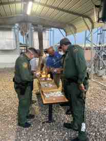 US Border Patrol Agents in McAllen TX enjoy muffins and Thank You cards