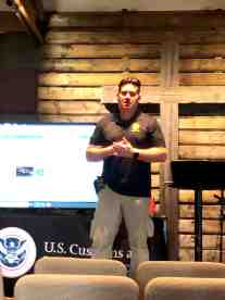 San Diego Sector Chaplain William Josa standing on the stage, addressing the attendees at the training called Bulletproof Your Relationships